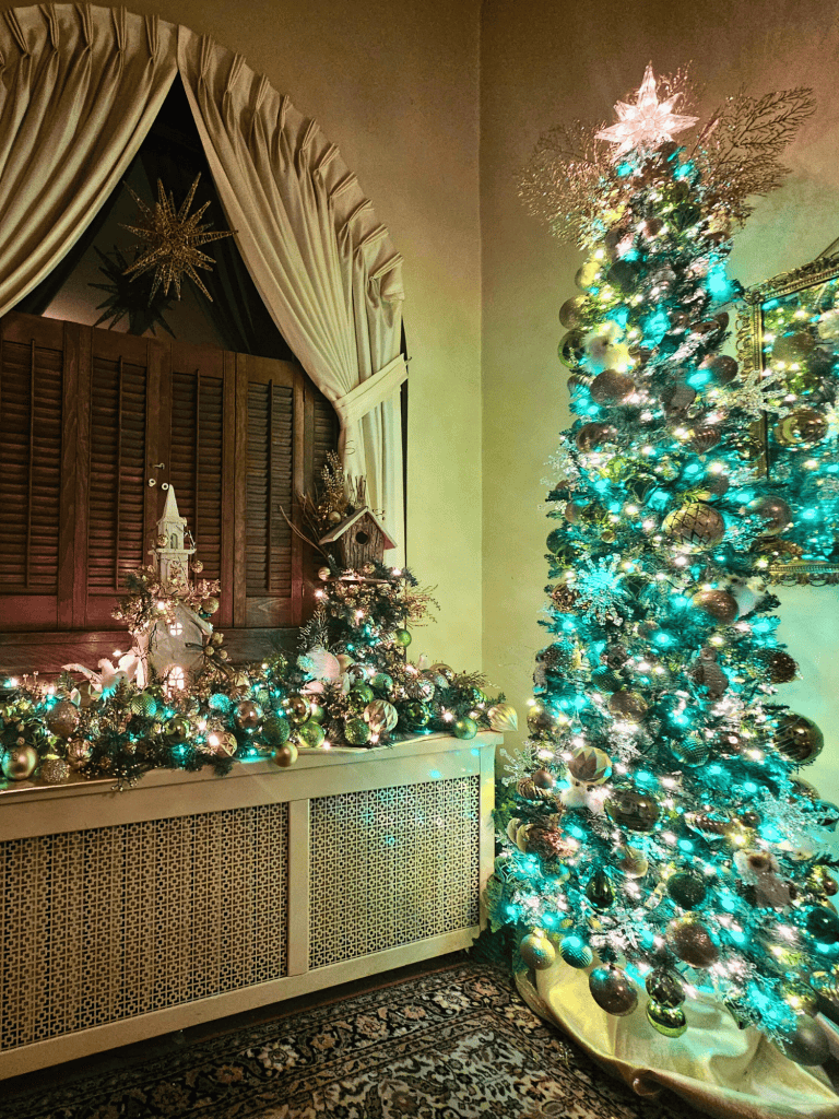 Christmas decorated room with a festive Christmas tree and elegant holiday decor in a custom-designed space.