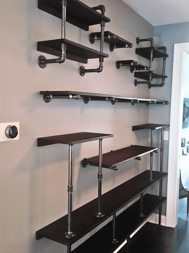 Industrial pipe shelving custom-designed for functional and stylish storage solutions.