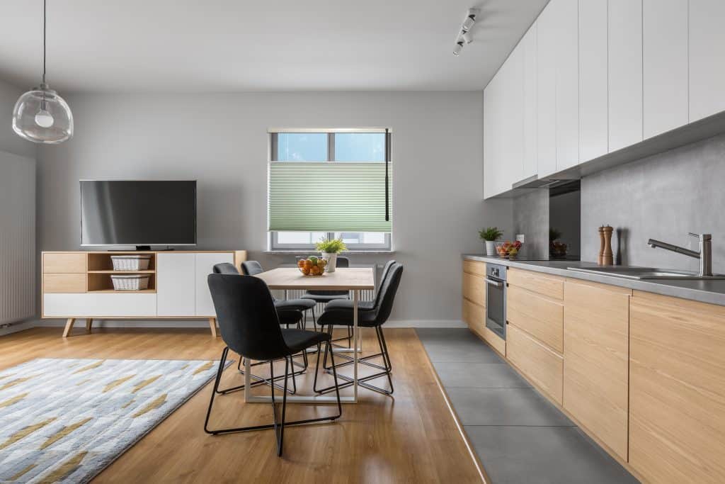Modern,Apartment,With,Open,Wood,Kitchen,With,Table,And,Long